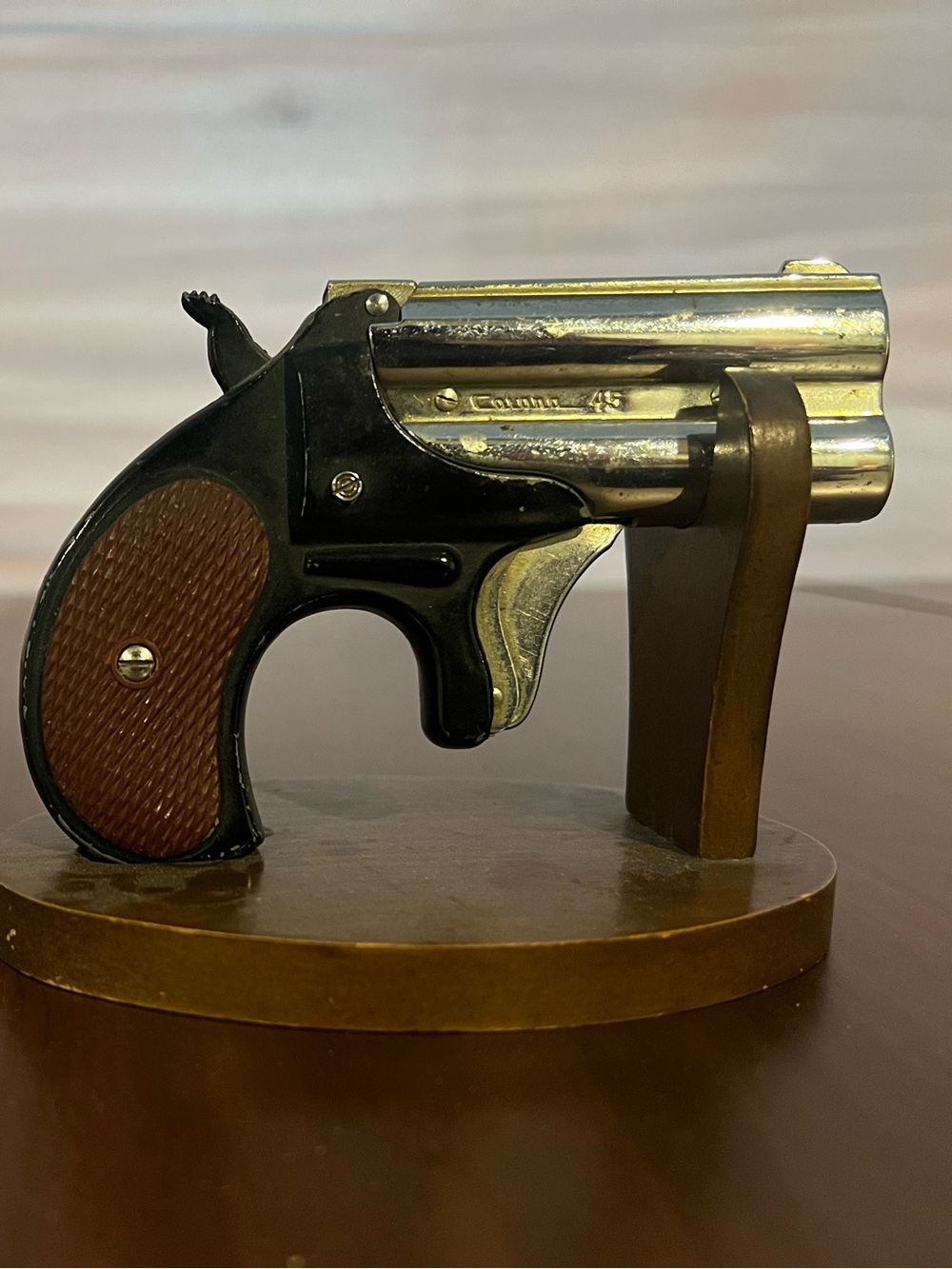 Vintage Corona 45 Novelty Pistol table lighter.